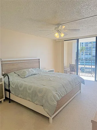 a bedroom with a bed and a lamp