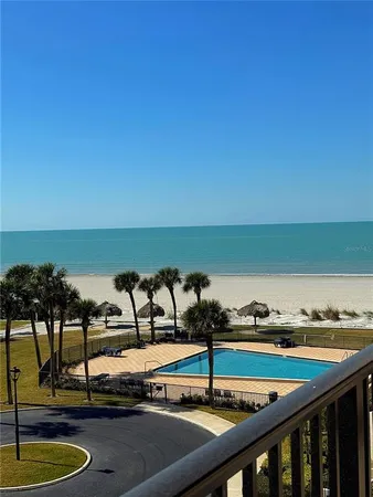 a view of swimming pool with outdoor seating