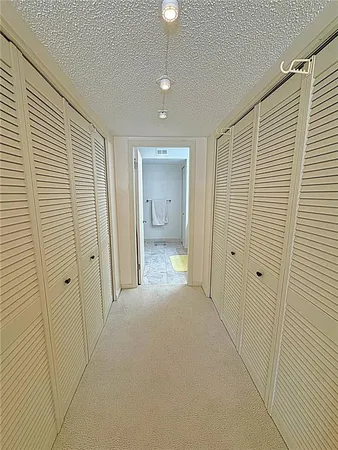 a bathroom with a shower and a sink