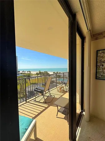 a view of a balcony with lake and mountain view