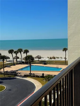 a view of swimming pool with outdoor seating