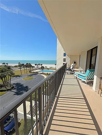 a view of a balcony with chairs
