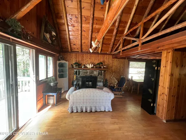 a living room with furniture and a stove