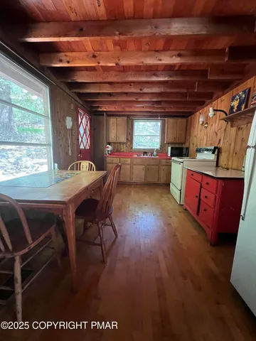 a view of hallway with wooden floor