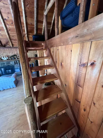 a view of livingroom with furniture wooden floor and front door