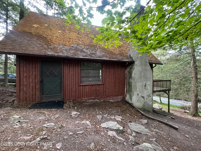 a view of barbeque grill with wooden floor and fence
