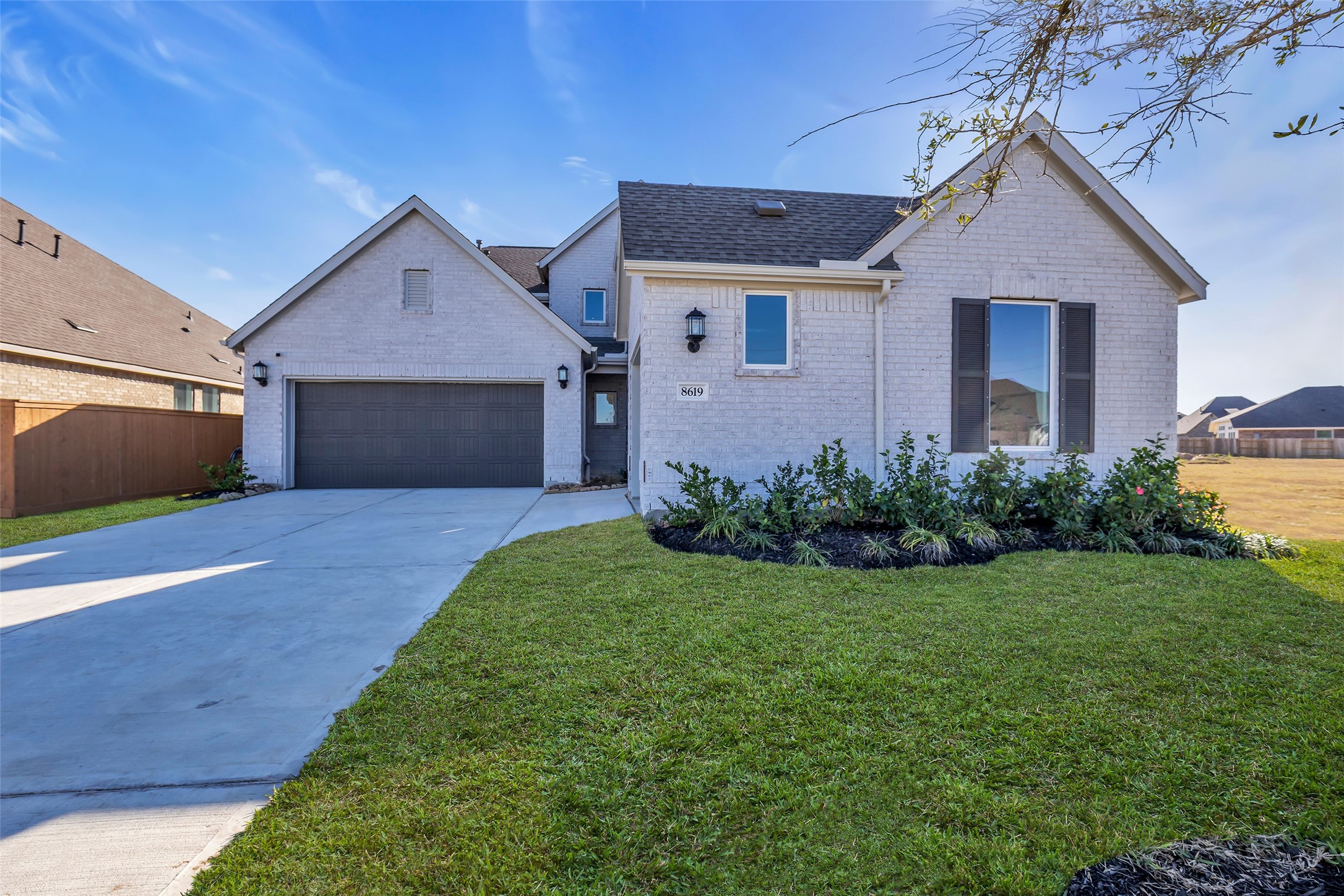 8619 Jade Hl Drive Rosharon, TX 77583 - Photo 3 of 50 Front Exterior Detail: Clean brickwork and simple lines give this home a fresh, modern look. The well-kept lawn and quiet setting create an immediate sense of ease and everyday comfort.