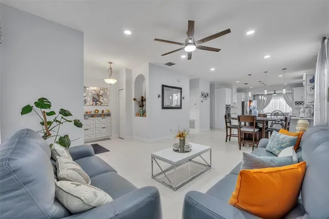 a kitchen with a sink window and stainless steel appliances