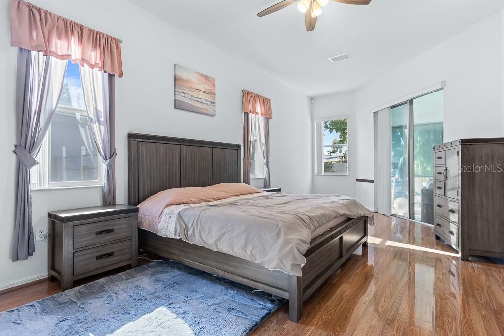 828 Innergary Place Valrico, FL 33594 - Photo 11 of 20 a bed sitting in a bedroom next to a window