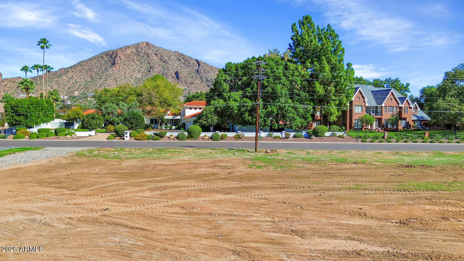 5335 East Exeter Boulevard, Unit 45 Phoenix, AZ 85018 - Photo 2 of 7 a view of street with houses