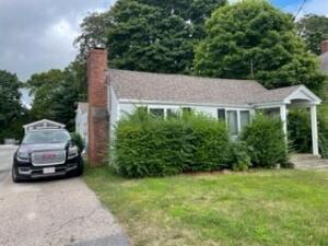 104 High School Road Hyannis, MA 02601 - Photo 12 of 14 a car parked in front of a house
