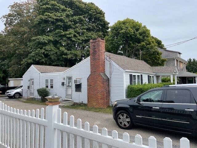 104 High School Road Hyannis, MA 02601 - Photo 14 of 14 a front view of a house with parking space