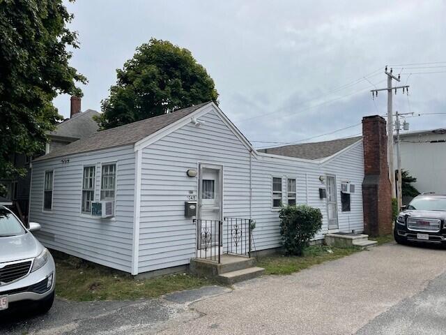 104 High School Road Hyannis, MA 02601 - Photo 2 of 14 a view of a house with a cars park
