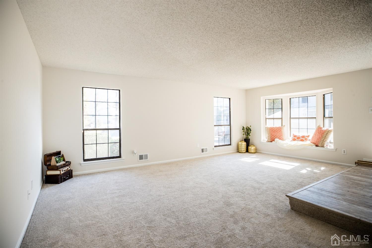 1601 Timber Oaks Road Edison, NJ 08820 - Photo 2 of 29 a view of an empty room with a window