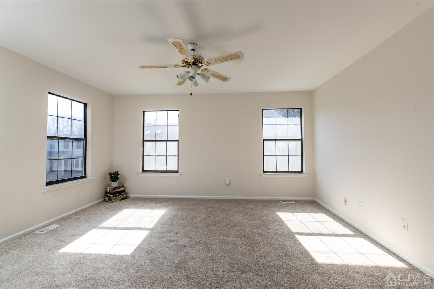 1601 Timber Oaks Road Edison, NJ 08820 - Photo 14 of 29 wooden floor in an empty room with a window