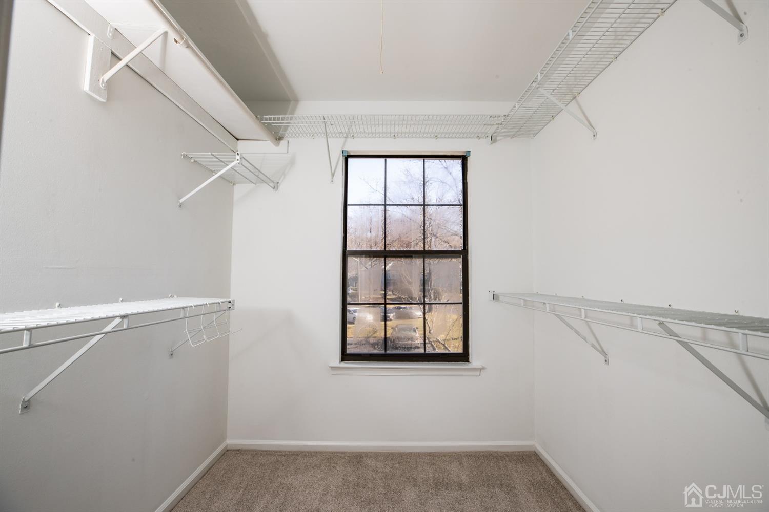 1601 Timber Oaks Road Edison, NJ 08820 - Photo 16 of 29 a view of an empty room with a window