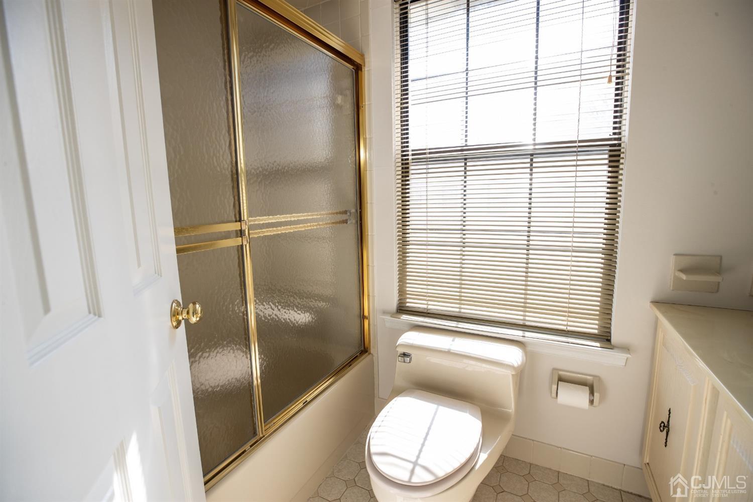 1601 Timber Oaks Road Edison, NJ 08820 - Photo 23 of 29 a bathroom with a toilet and a shower