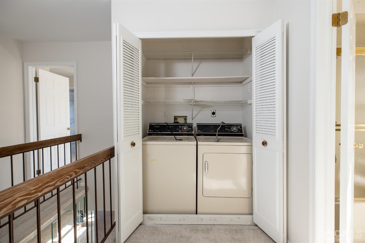1601 Timber Oaks Road Edison, NJ 08820 - Photo 25 of 29 a kitchen with a refrigerator and white cabinets