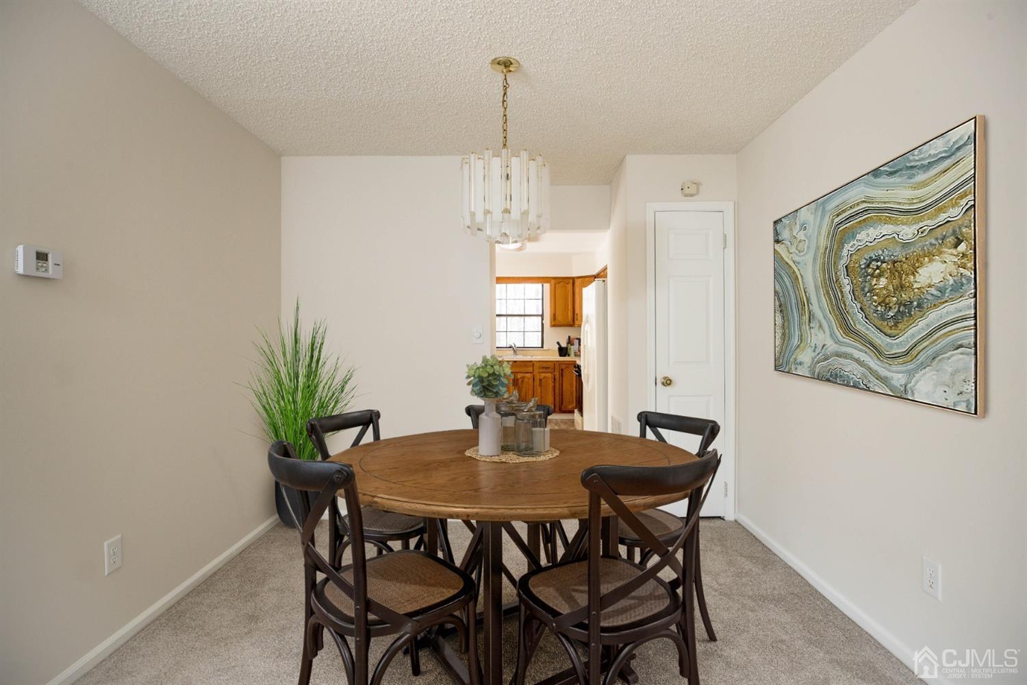 1601 Timber Oaks Road Edison, NJ 08820 - Photo 6 of 29 a dining room with furniture and window