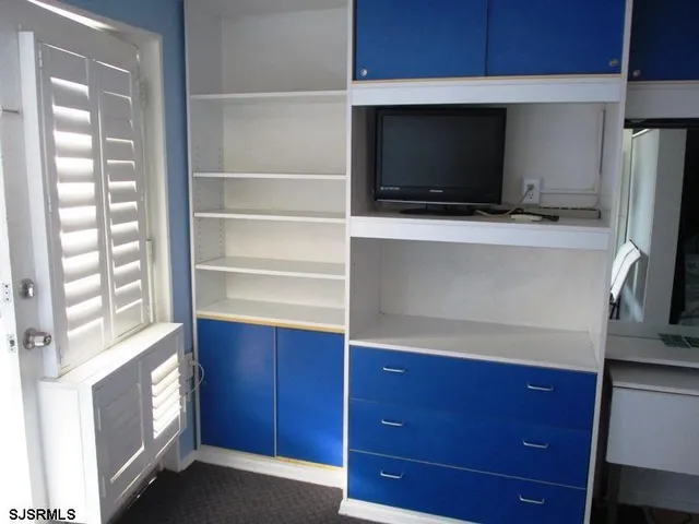 a bedroom with a bed and a bathroom