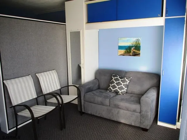 a view of living room with furniture and flat screen tv