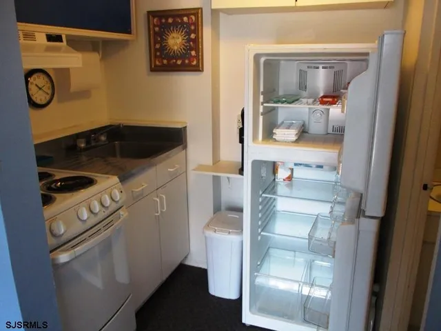 a view of a swimming pool with an outdoor seating