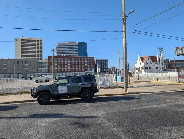a view of a balcony with wooden floor and fence