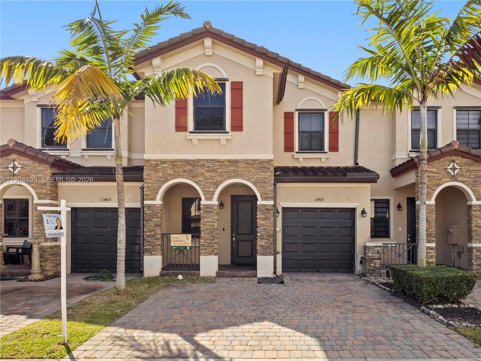 11410 Southwest 252nd Terrace Homestead, FL 33032 - Photo 1 of 38 a front view of a house with garden