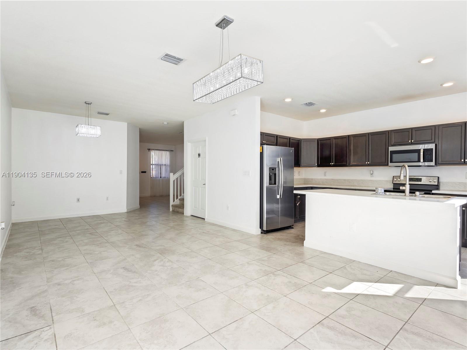 11410 Southwest 252nd Terrace Homestead, FL 33032 - Photo 13 of 38 a view of a kitchen with a sink and cabinets