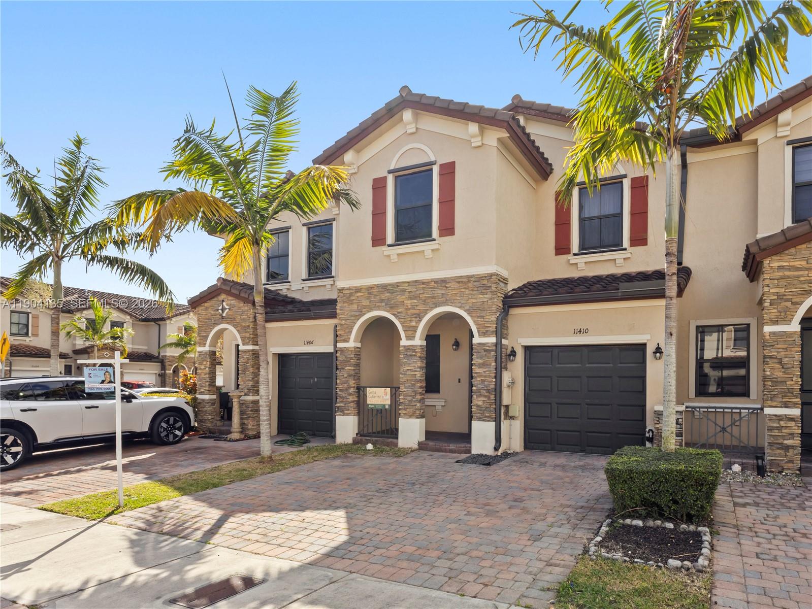11410 Southwest 252nd Terrace Homestead, FL 33032 - Photo 2 of 38 a front view of a house with swimming pool