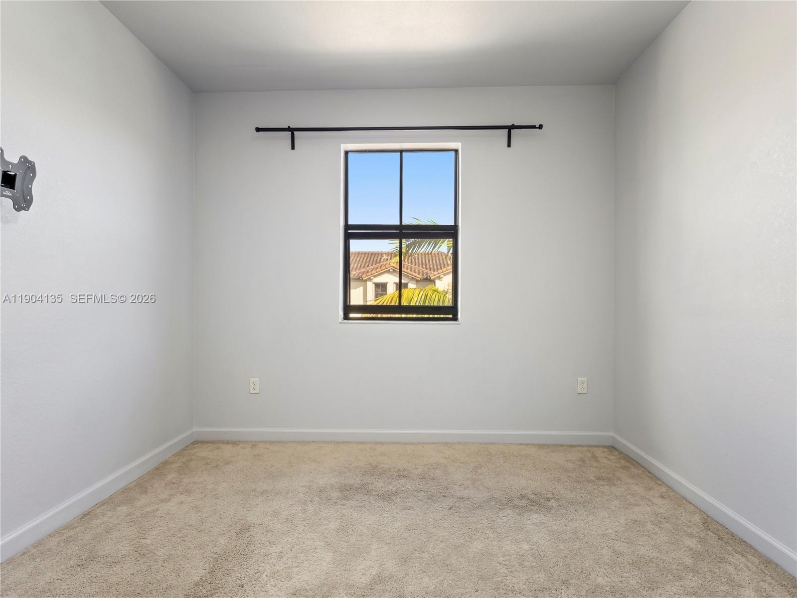 11410 Southwest 252nd Terrace Homestead, FL 33032 - Photo 27 of 38 an empty room with a window