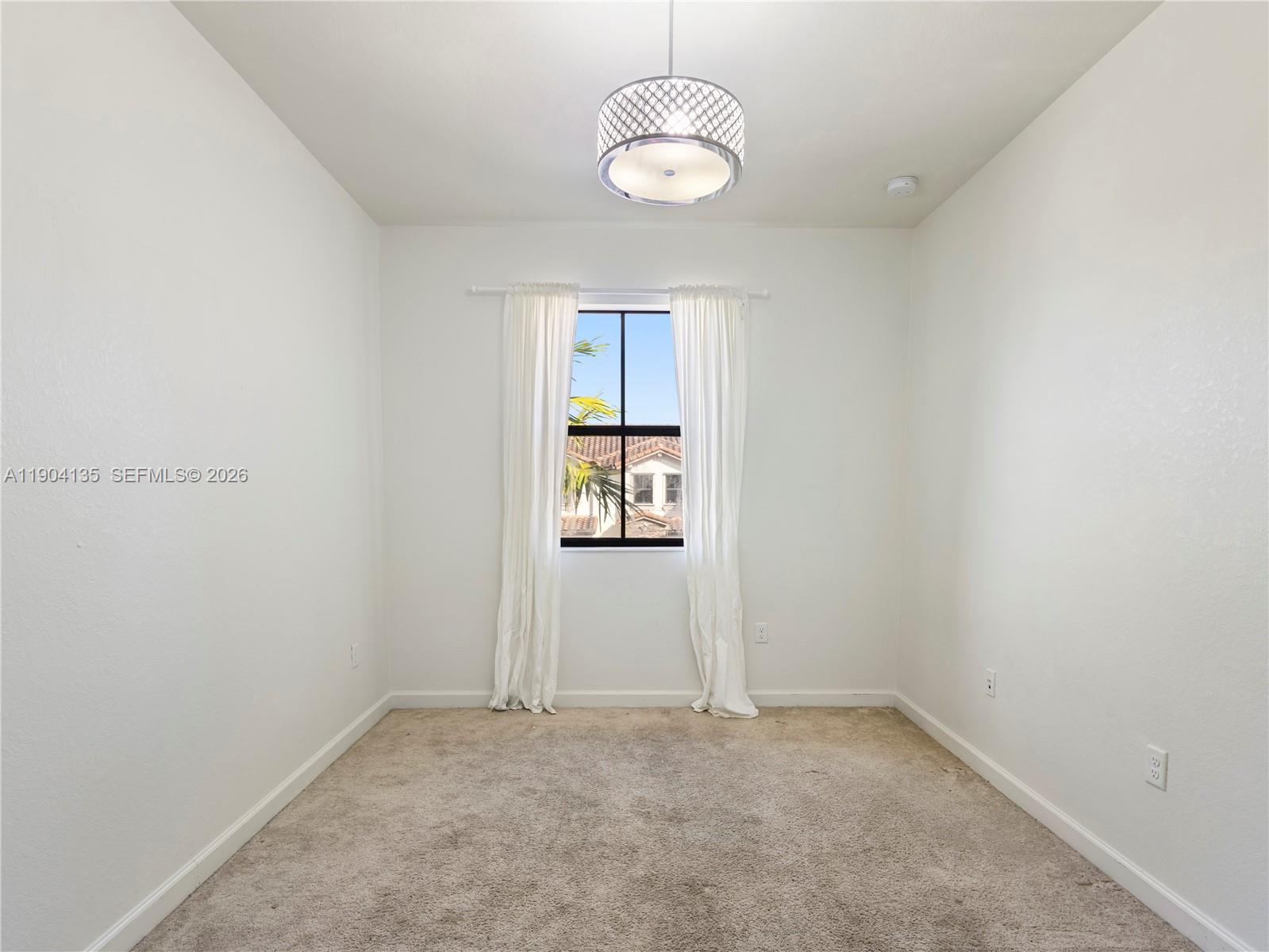 11410 Southwest 252nd Terrace Homestead, FL 33032 - Photo 30 of 38 an empty room with a window
