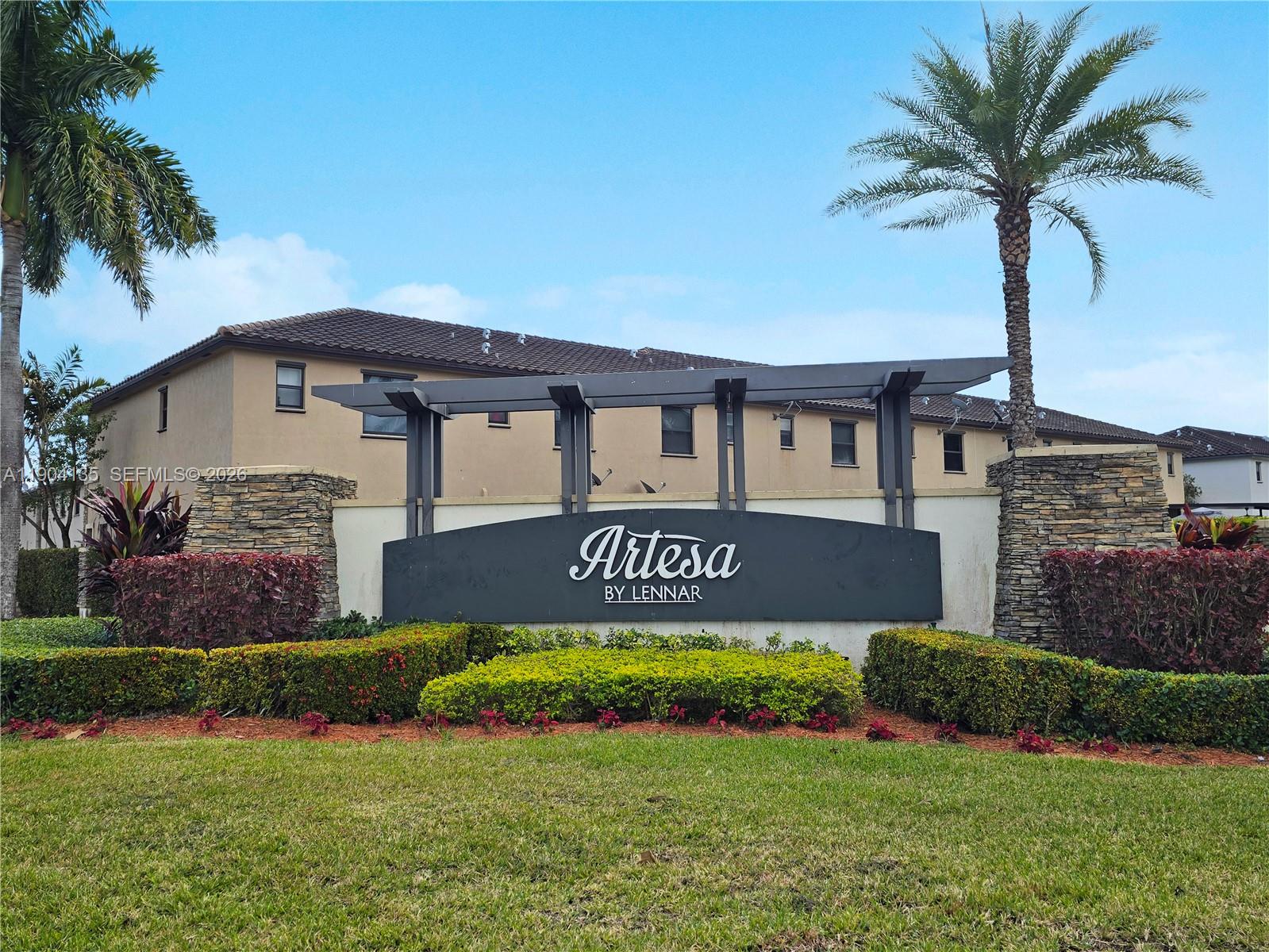 11410 Southwest 252nd Terrace Homestead, FL 33032 - Photo 3 of 38 a sign on the side of a house