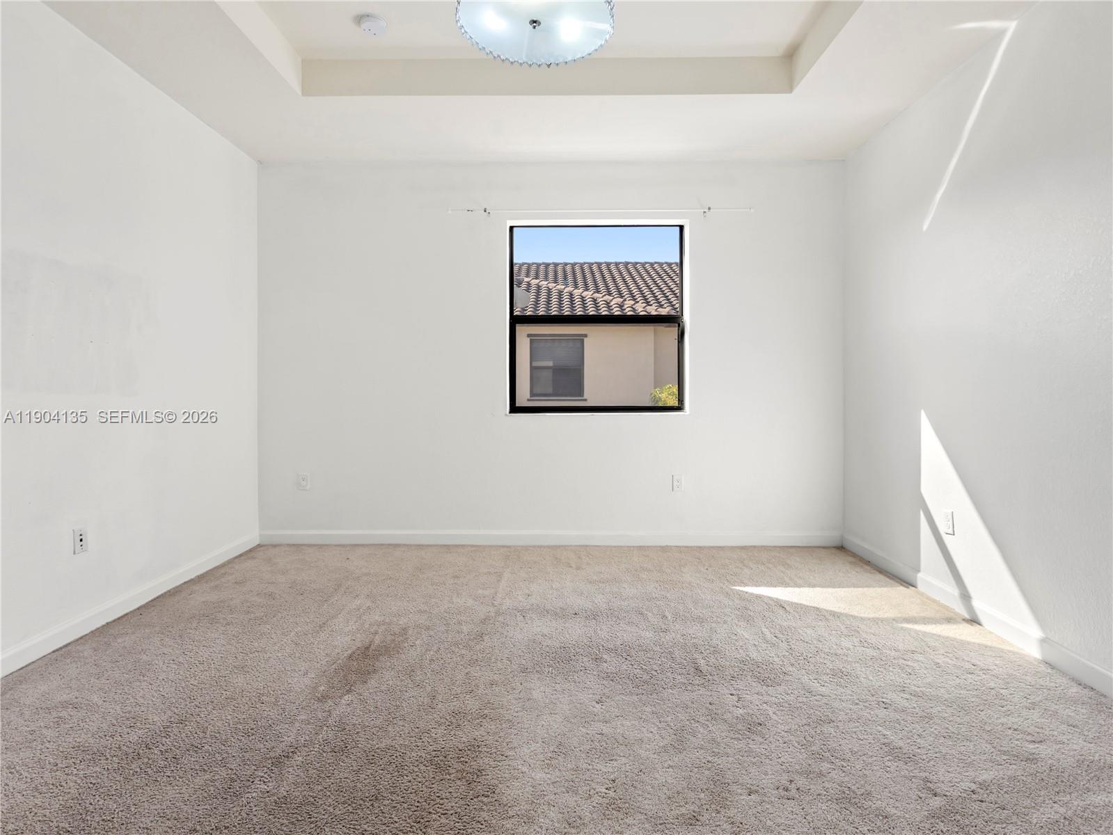 11410 Southwest 252nd Terrace Homestead, FL 33032 - Photo 32 of 38 an empty room with a window