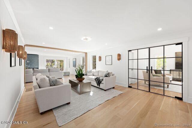 77 Stanton Road Darien, CT 06820 - Photo 14 of 39 a living room with furniture cabinets and a flat screen tv