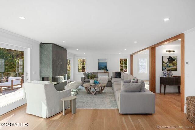 77 Stanton Road Darien, CT 06820 - Photo 15 of 39 a living room with fireplace furniture and a large window