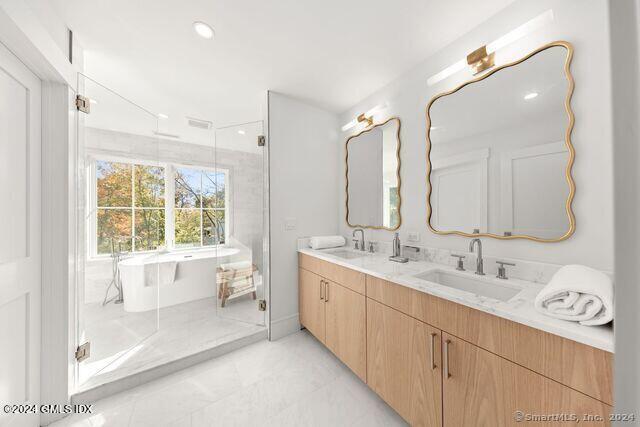 77 Stanton Road Darien, CT 06820 - Photo 27 of 39 a bathroom with a double vanity sink mirror and bathtub