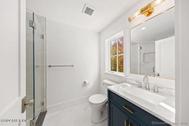 77 Stanton Road Darien, CT 06820 - Photo 32 of 39 a bathroom with a granite countertop sink toilet a large mirror and shower