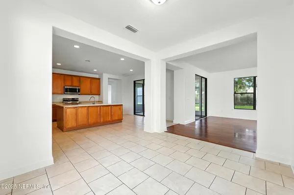 a view of an empty room with glass door