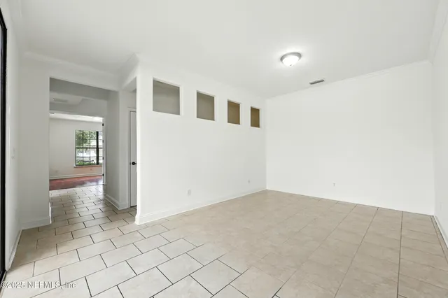 a spacious bathroom with a granite countertop sink mirror and shower