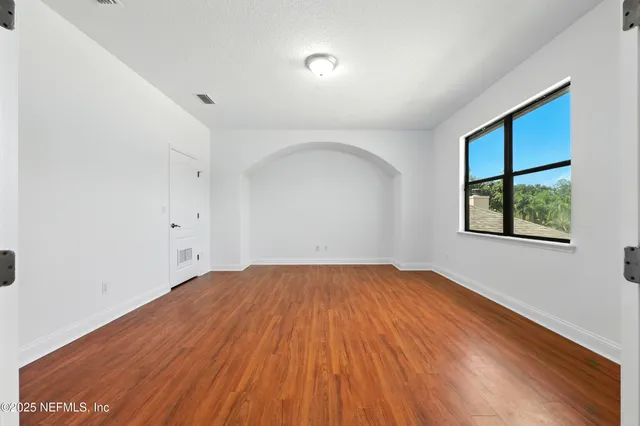 a view of backyard with tree