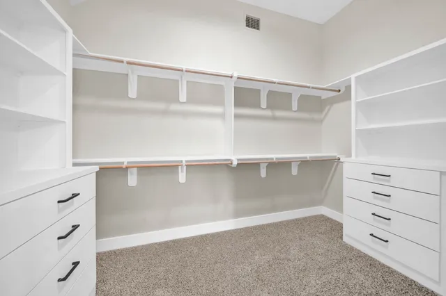a view of an empty walk in closet