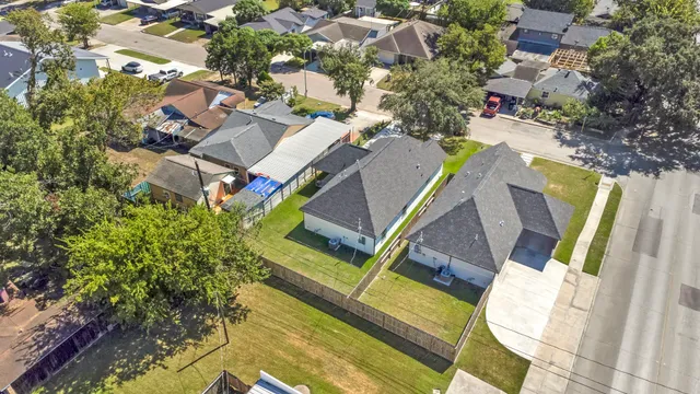 an aerial view of a house with a swimming pool