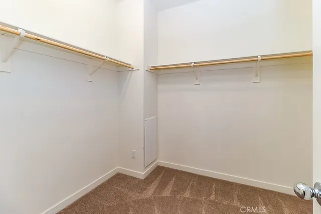 a spacious bathroom with a double vanity sink and a mirror
