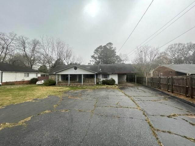 a front view of a building with a yard