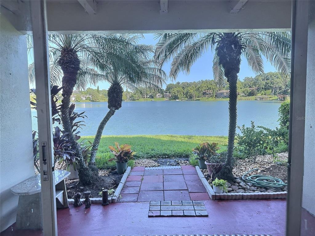 620 Orange Drive, Unit 225 Altamonte Springs, FL 32701 - Photo 1 of 25 a view of entryway with a floor to ceiling window and potted plants