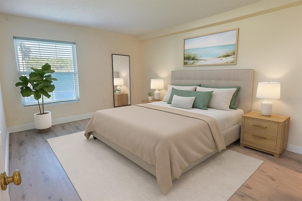 620 Orange Drive, Unit 225 Altamonte Springs, FL 32701 - Photo 8 of 25 a bedroom with a bed and a potted plant