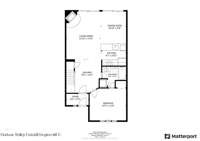 a picture of a bench in front of a wall