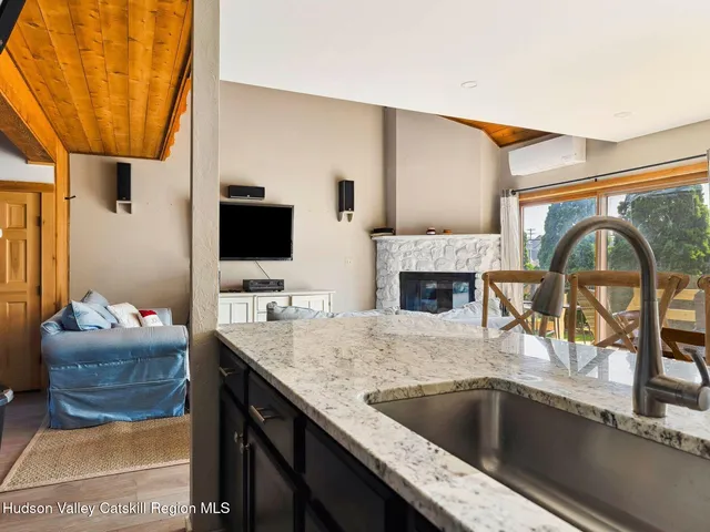 a living room with a couch and a flat screen tv