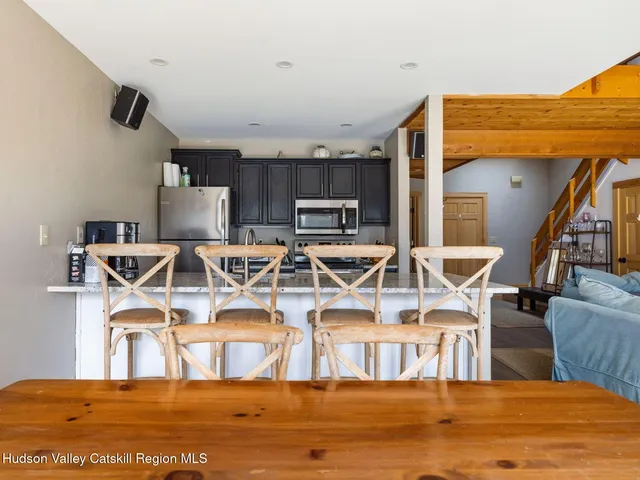 a view of a living room and kitchen